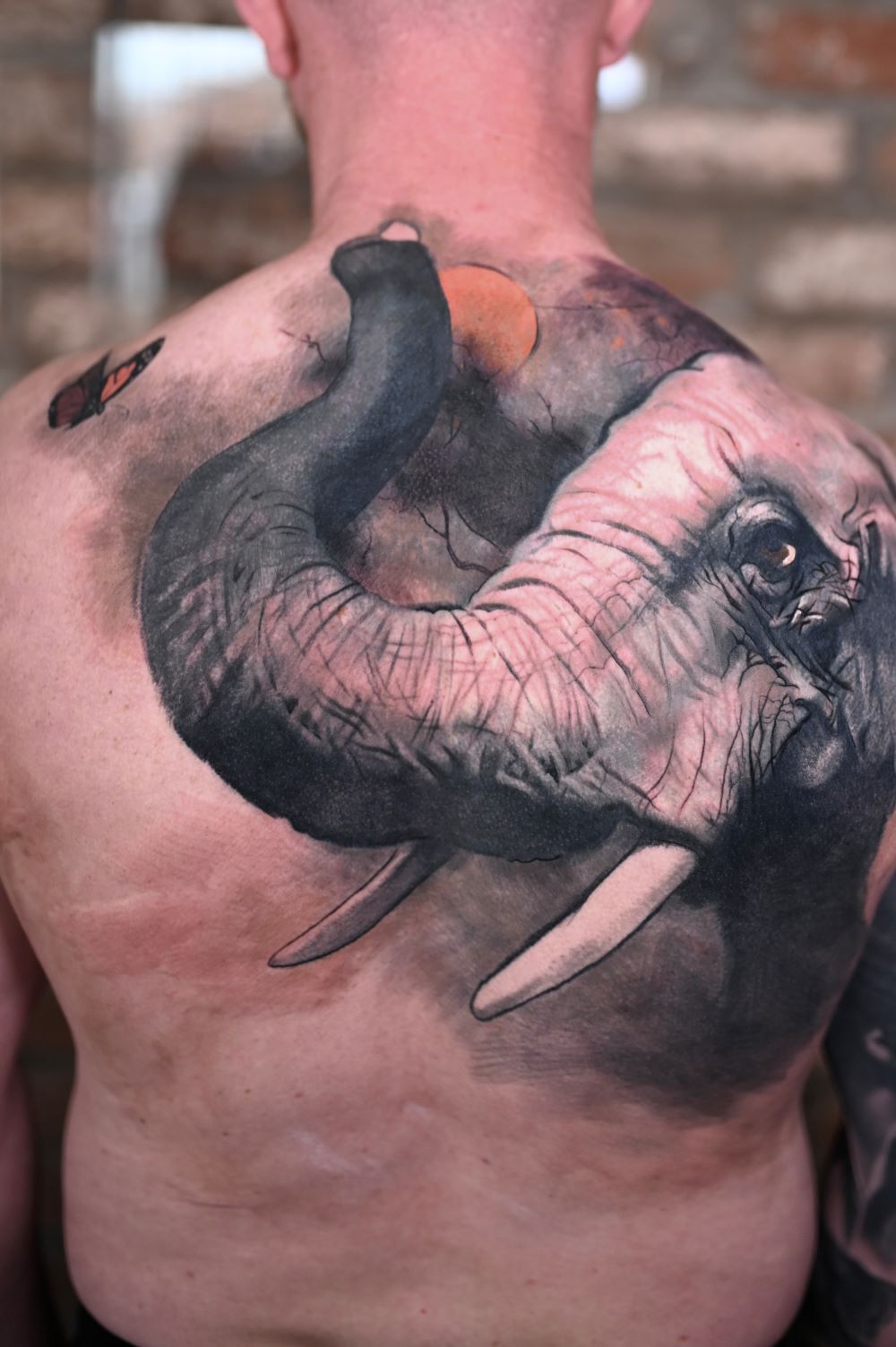 Fine line flower tattoo Glasgow minimalist artist